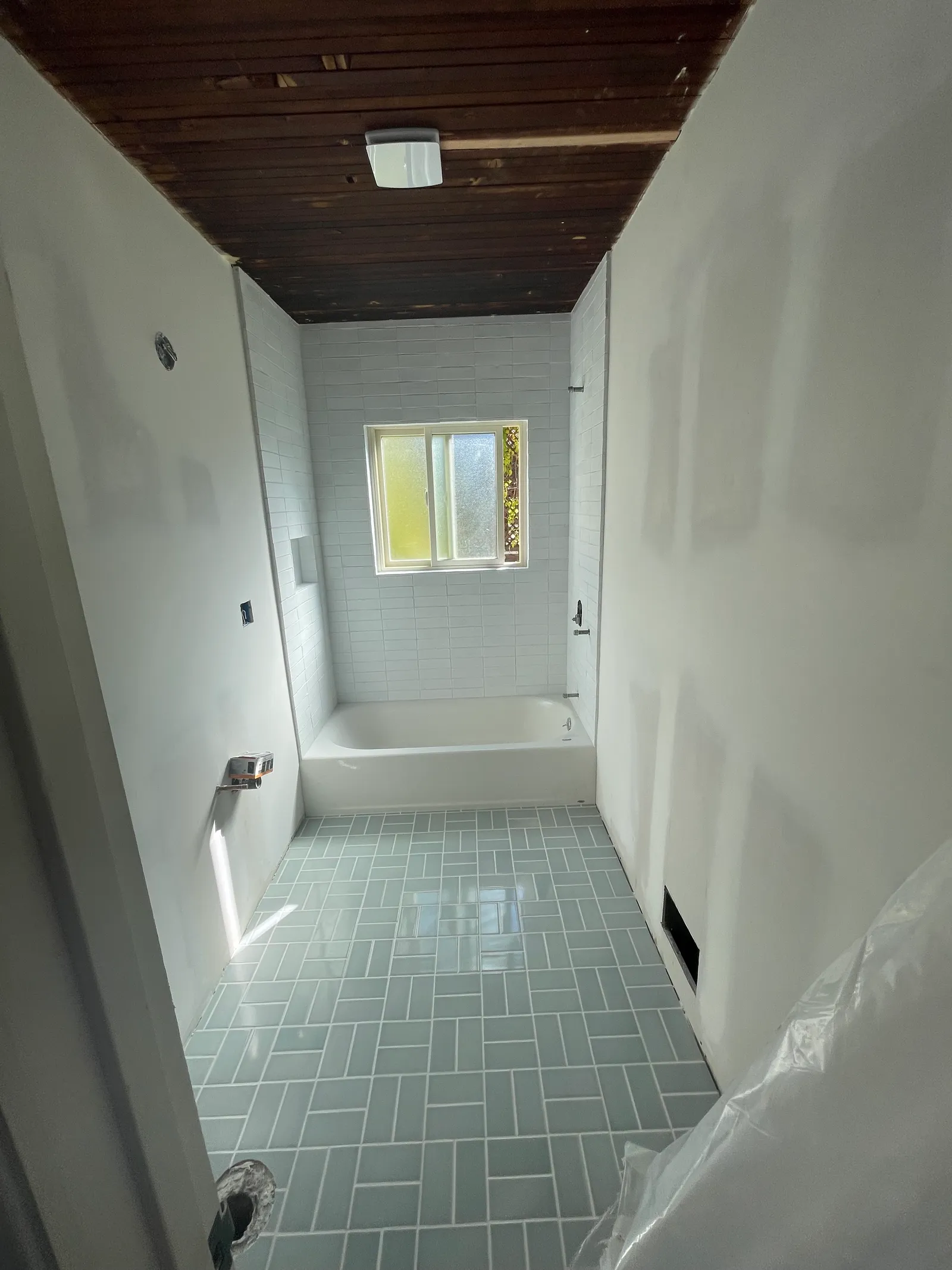 Tub and shower tile detail with corner shelf and valve rough-in
