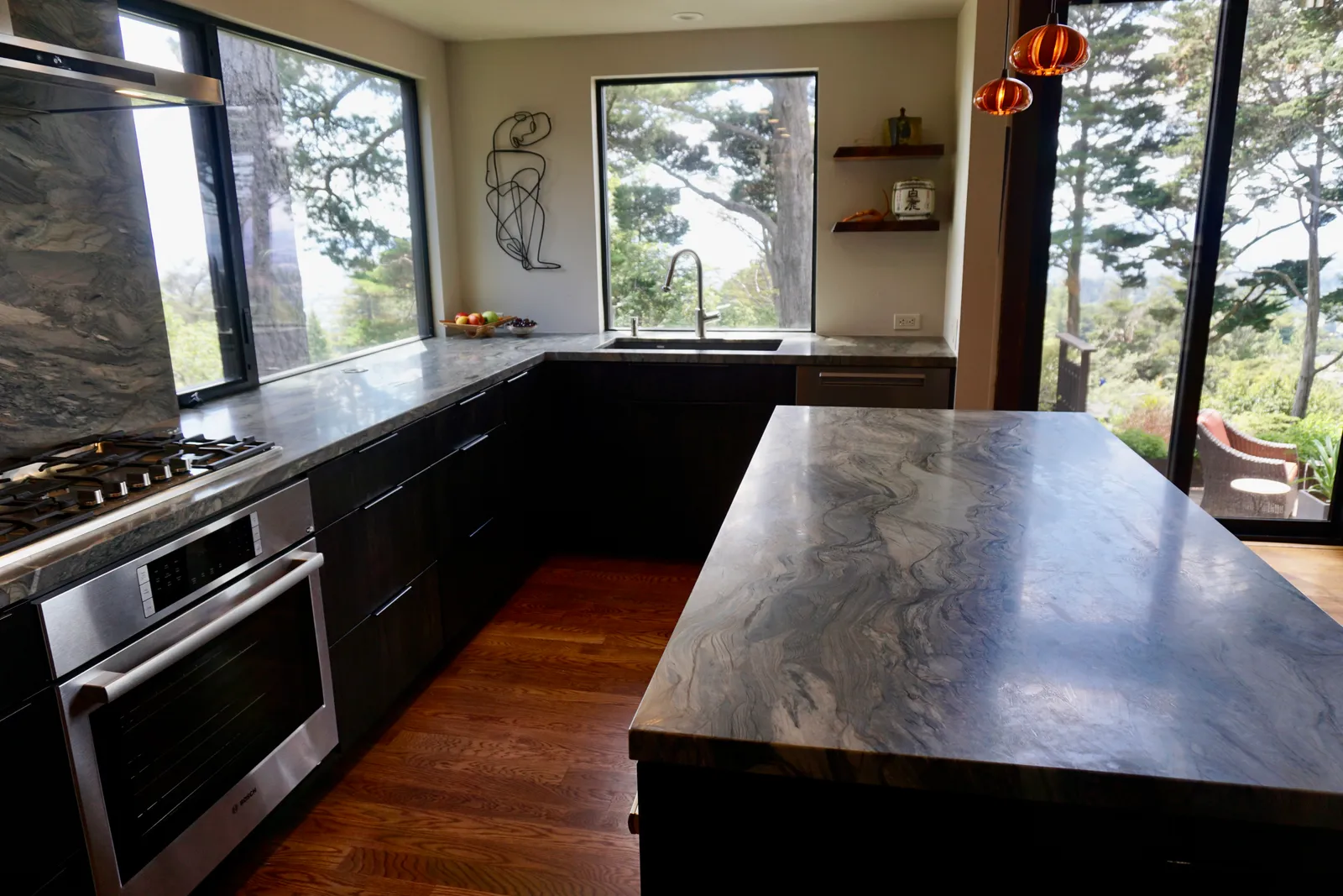 Modern kitchen marble countertop with undermount sink and window views